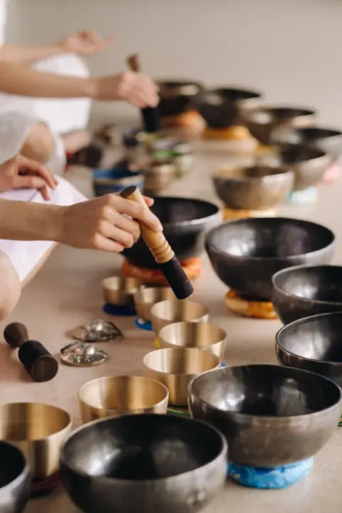 Close-up of a Tibetan singing bowl held in two hands
