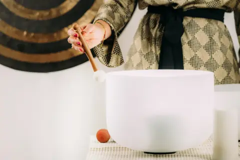 White crystal singing bowls set out for a sound healing session