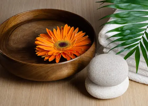 Spa setting with towels, stones and candles
